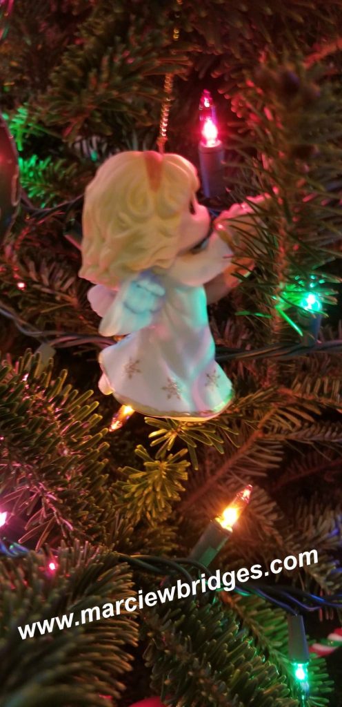 This image has an empty alt attribute; its file name is Angel-Ornament2-496x1024.jpg